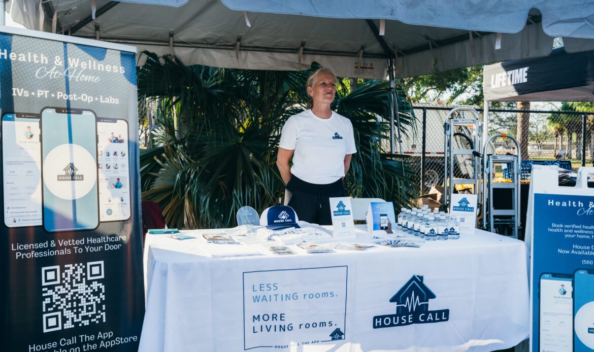 Ingrid Olsen Stands at House Call The App Festival Finish Booth at the Miami Life Time Turkey Trot 5k